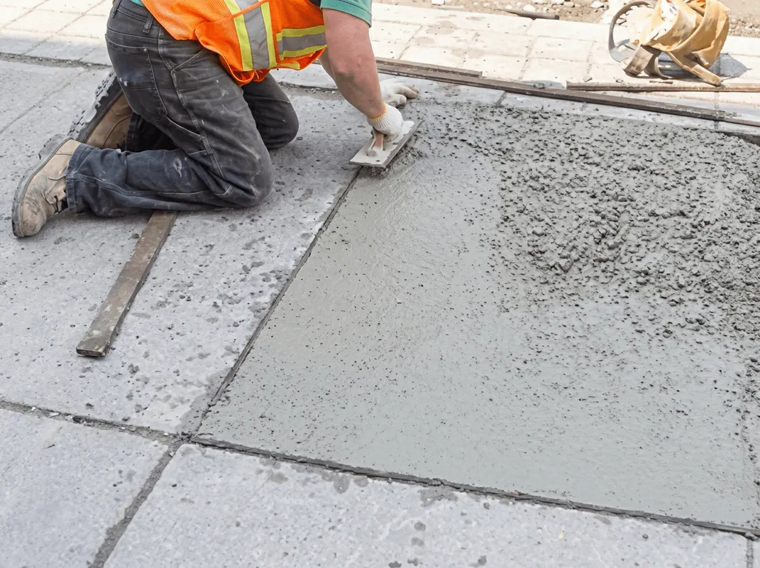 Professional repairing a concrete floor in Erie, PA